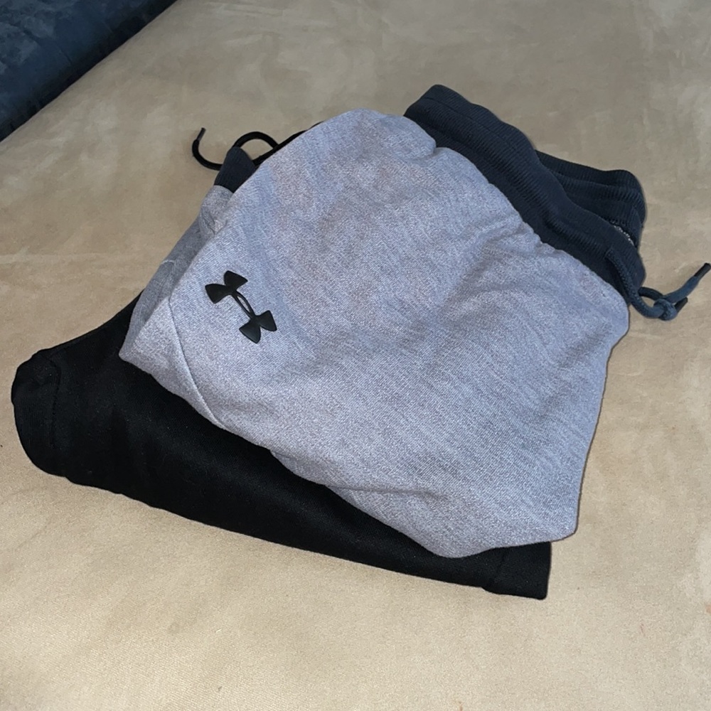 Two Sweat pants joggers. Black young La size medium. Grey Under Armour.